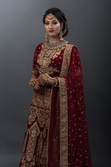 Young Indian female in ethnic Indian wear celebrating festival of Diwali. Indian female with bridal make-up and bridal wear