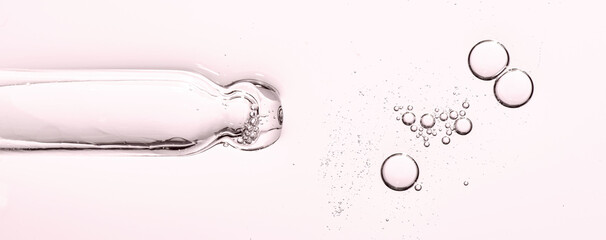 The texture of a cosmetic serum with a pipette closeup. Macrophotography