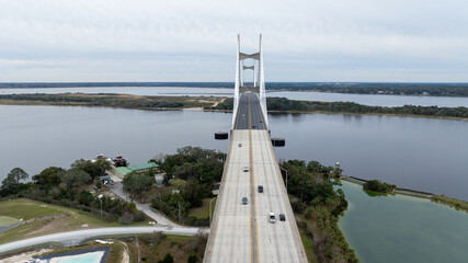 The Dames Point Bridge in Jacksonville, Florida, captured in daylight with cars driving over and...