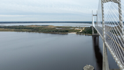 The Dames Point Bridge in Jacksonville, Florida, captured in daylight with cars driving over and...