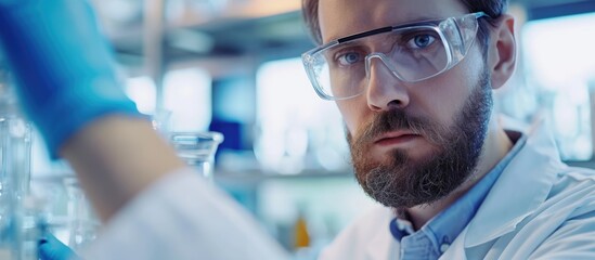 Happy intelligent researcher adjusting glasses.