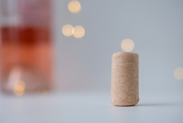 Synthetic wine cork. Bottle of rose wine. Bokeh. Copy space. 