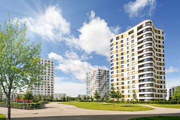 Residential area in the city, modern sustainable high-rise apartment buildings in a green...