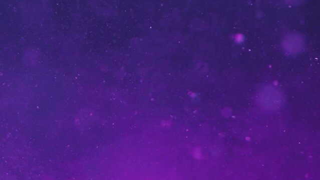 Bubbles background. Oxygen liquid. Ocean underwater. Violet ink with air round spheres floating with blur bokeh shimmering spots in abstract art.