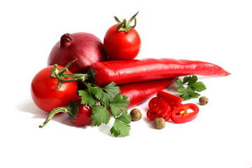 Vegetables with herbs lie on a white background.
