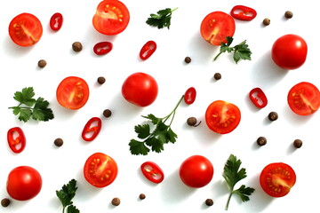 Texture of chopped tomatoes, hot peppers and parsley on a white background.
