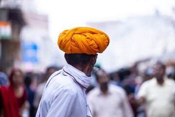Pushkar fair, Portrait of an rajasthani old male in white traditional dress and colorful turban at pushkar fair ground. 