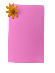 pink sticky note with corner of the small yellow flower