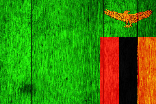 Flag of Republic of Zambia on a textured background. Concept collage.