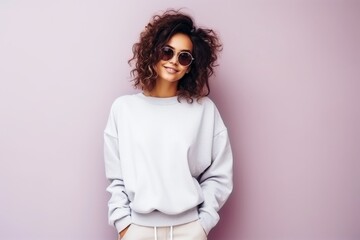 Obraz premium Young sassy fashion model on a pastel colored background.