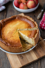 German quark cake or cheesecake on wooden table