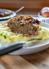 Meatloaf with cabbage and mashed potatoes on a plate. Home cooked meal