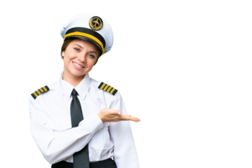 Airplane pilot woman over isolated chroma key background presenting an idea while looking smiling towards