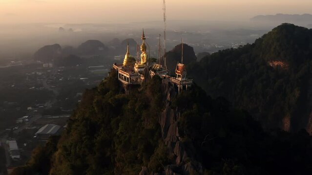Aerial orbit shot of Tiger cave temple Wat Tham Suea Krabi Thailand during sunrise