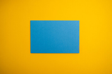 Paper yellow and blue envelopes on a light background. New mail, write a message. Send and receive mail. Postal delivery service. Empty envelope, empty space. Envelope close-up 