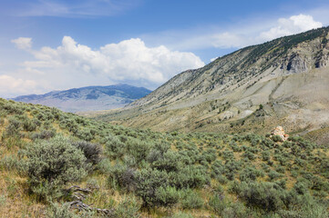 Yellowstone National Park with foothills and valley of sagebrush. Wyoming, USA.