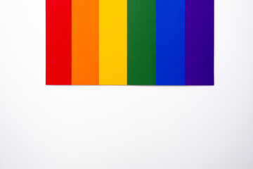 Rainbow flag on a light background. LGBT flag. LGBTQIA Pride Month in June....