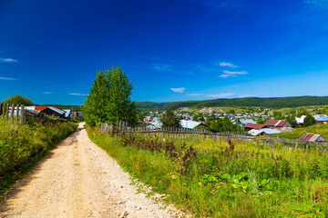 Fototapeta na wymiar Road pass view to walkway and mountains. Carpathians in Summer