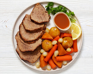 roast beef with dipping sauce and winter veggies