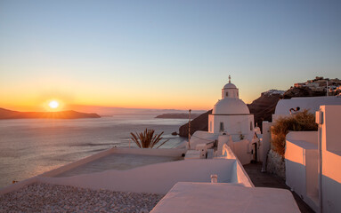 Sunset at Oia village on Santorini island, Greece - obrazy, fototapety, plakaty