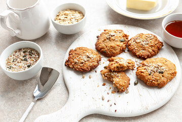 Traditional homemade oatmeal cookies with sesame and sunflower seeds and ingredients for baking them
