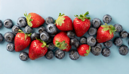 Top view pile of blueberries and strawberries everywhere on the blue background - obrazy, fototapety, plakaty