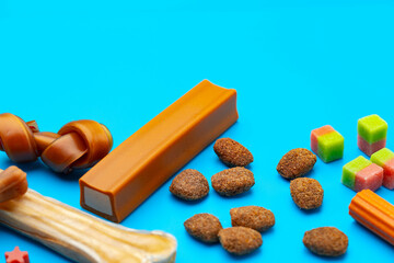 Pet snacks for dogs on blue background