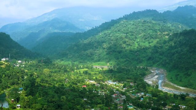 Jhalong view point situated near India Bhutan border. Rocky mountains are covered with green forest. river Jaldhaka is flowing bellow the mountains