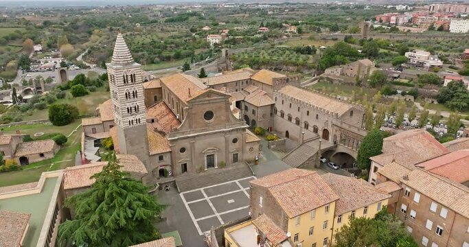 Aerial view of the cityscape of Viterbo, Italy. A beautiful historical city with an ancient cathedral and a church in the center of the old city. High quality 4k footage