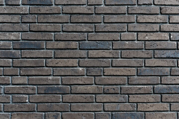 Brick wall with varied brown bricks texture