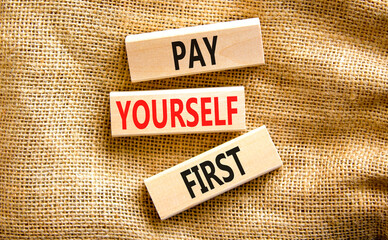 Pay yourself first symbol. Concept words Pay yourself first on beautiful wooden blocks. Beautiful canvas table canvas background. Business and pay yourself first concept. Copy space.