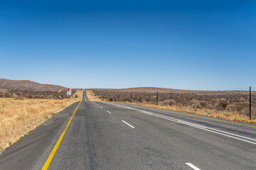 Fototapeta na wymiar tar road in barren countryside, near Karibib, Namibia