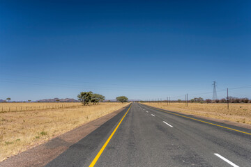 Fototapeta na wymiar tar road in barren countryside, near Usakos, Namibia