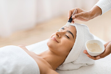 Soothing spa facial treatment for relaxed woman
