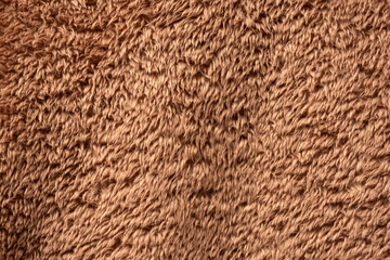 Texture of a brown faux fur as a background.