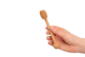 Honey dipper in woman hand isolated on a white background.
