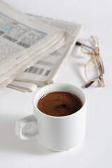 Coffee, newspaper and glasses