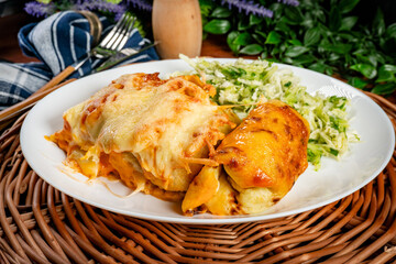 Stuffed pancake baked with cheese.