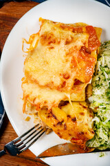 Stuffed pancake baked with cheese.
