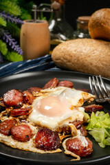 Fried egg and sliced sausage.