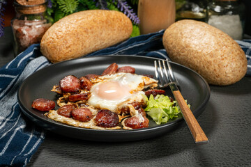 Fried egg and sliced sausage.