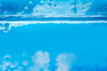 Unusual and bizarre cloud formations in a pale blue sky