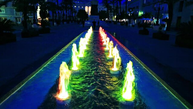 Cadiz, Andalusia, Spain - circa April, 2016: colorful dancing fountain at night in Plaza de San Juan de Dios in Cadiz historic center in Spain.