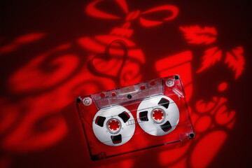 Light projections on a festive Christmas theme on table vith audio cassette