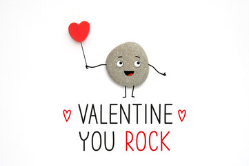 Funny cute stone and text Valentine you rock. Cool encouragement concept. Realistic stone with...