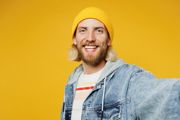 Close up young smiling blond man he wears denim shirt hoody beanie hat casual clothes doing selfie...