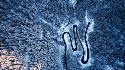 Top view of spectacular mountain road in winter.Serpentines from Romania mountains Fagaras.