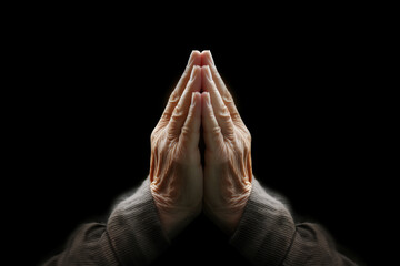 elderly persons hands praying
