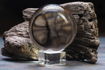 Magic crystal ball on the wizard table close up background concept.