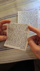 inside Mezuzah jewish Papyrus scroll Klaf inscribed with Hebrew verses from the sefer Torah Jewish mitzvah prayer Shema Yisrael